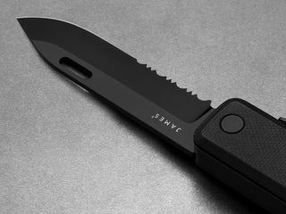 The serrated blade of The Ellis EDC folding multitool pocket knife.