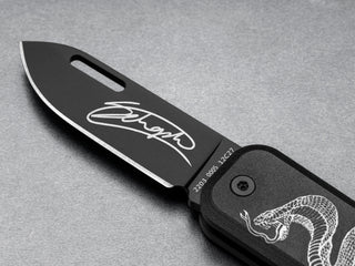 The James Brand and Schoph collab Elko EDC keychain pocket knife with a signed blade.