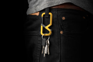The Bryce Wong artist series Mehlville EDC keychain carabiner hanging from a belt loop with keys attached..