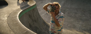Professional skateboarder and photographer Arto Saari taking a photo.