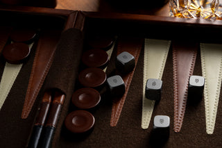The TJB titanium dice set being used to play backgammon.
