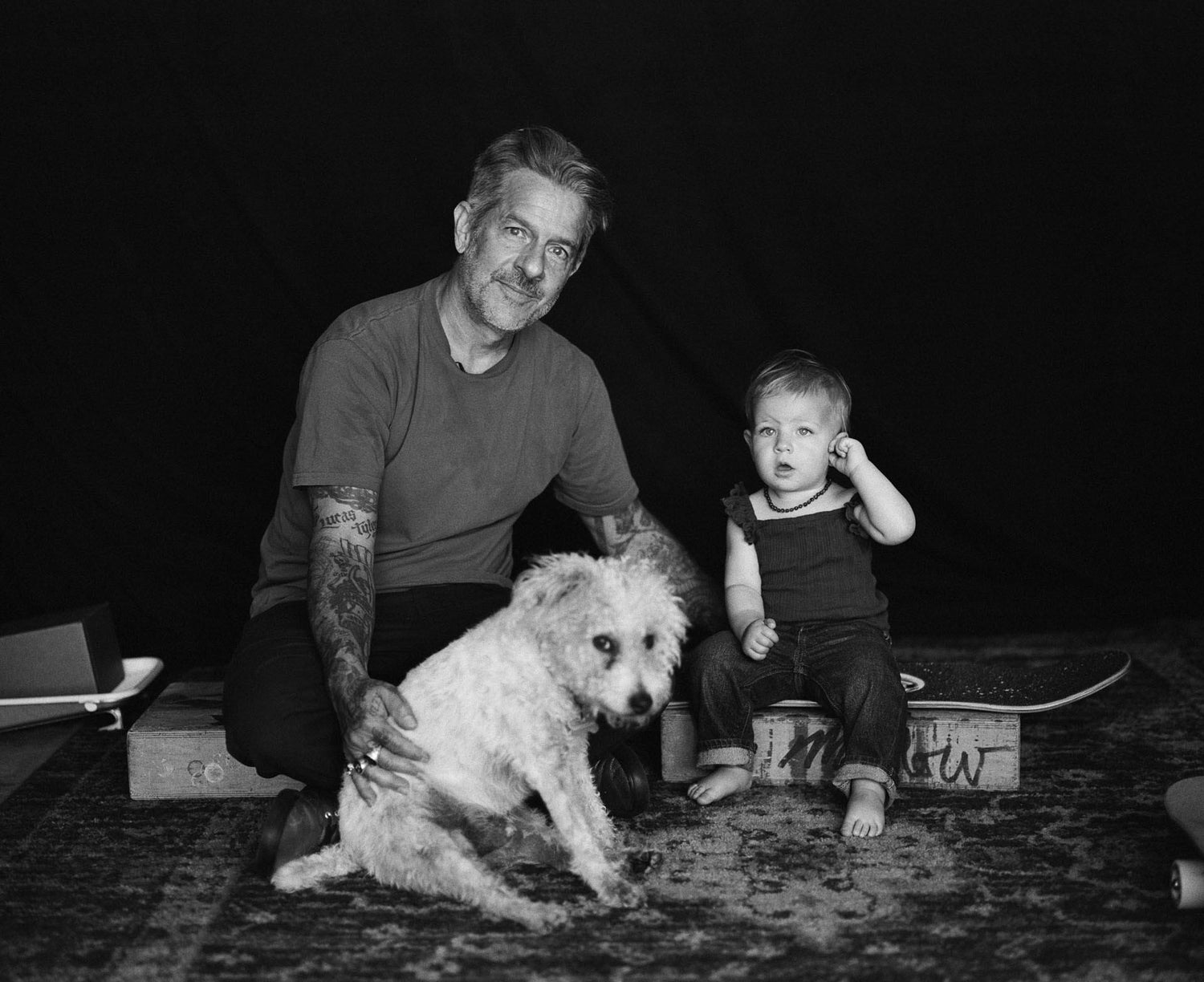 Artist Mark Oblow with his kid and dog.