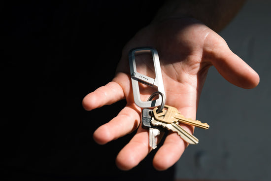A person with the Madison carabiner in their palm.