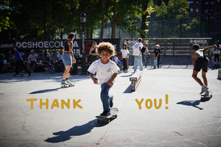 A kid skating with Thank You graphics.