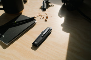 The Ellis folding slip joint pocket knife closed on a desk. 