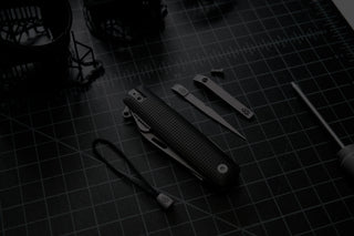 The Helton EDC multitool on a cutting mat.