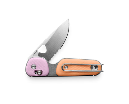 The Redstone slide lock serrated folding pocket knife in Sherbet and Pink Haze