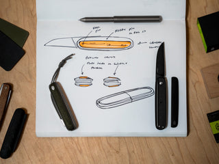The Pike classic gentlemen's slip joint folding pocket knife resting on sketches of the original concept. 